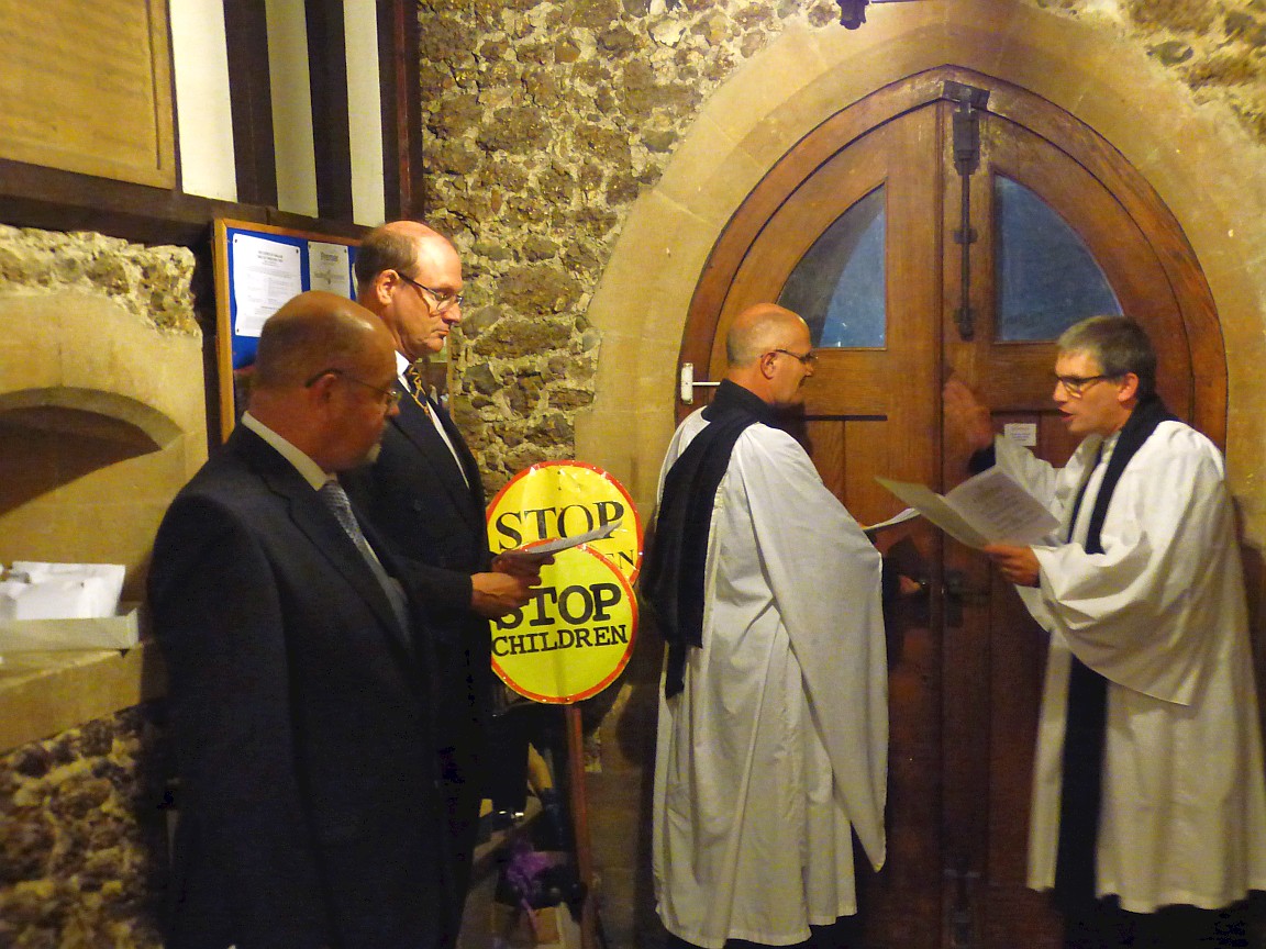 Churchwardens to left, Vicar in centre, Area Dean to right