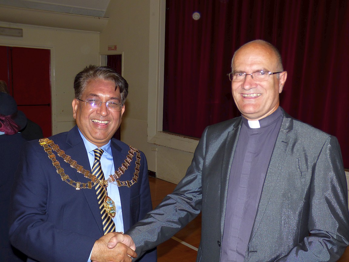 Vicar greeting the Mayor at the post-service reception